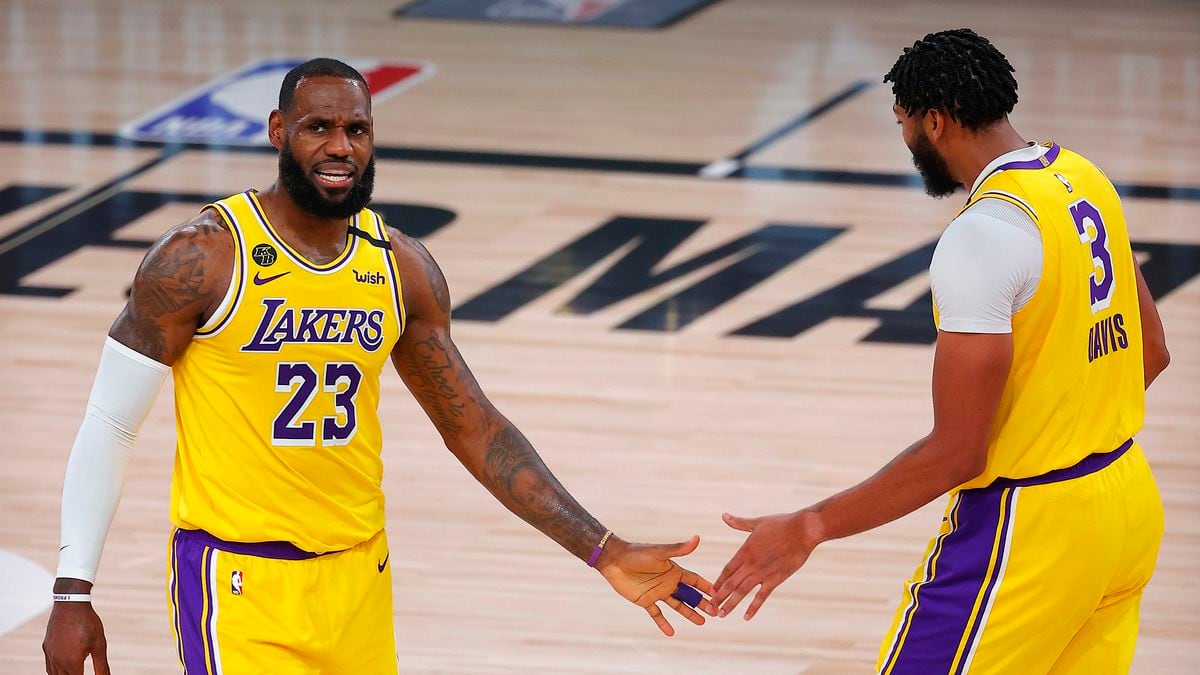 Los Angeles Lakers' LeBron James, left, and Anthony Davis react after a shot during the third quarter against the Portland Trail Blazers in Game 1 of an NBA basketball first-round playoff series, Tuesday, Aug. 18, 2020, in Lake Buena Vista, Fla.