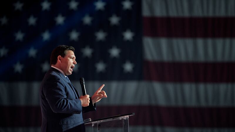 FILE - Florida Gov. Ron DeSantis addresses attendees during the Turning Point USA Student...