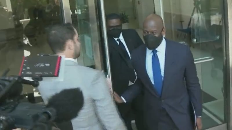 FILE PHOTO: Andrew Gillum walks out of court after entering a not guilty plea to fraud and...