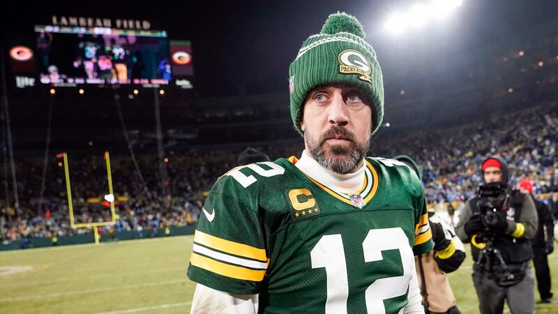 Green Bay Packers' Aaron Rodgers walks off the field after an NFL football game against the...