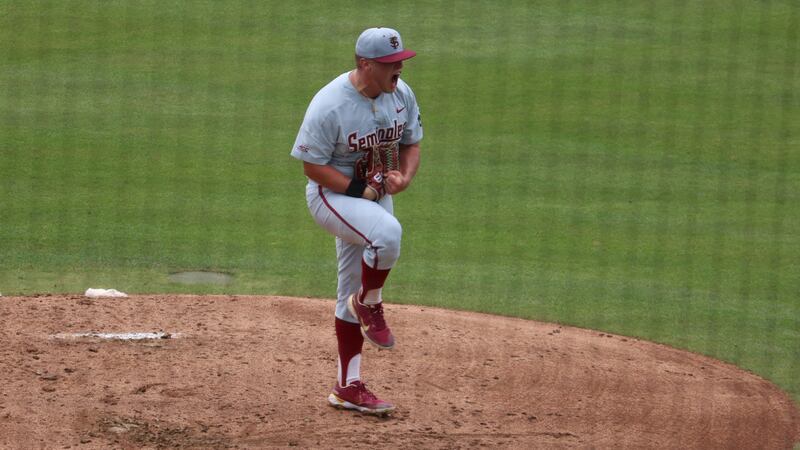 FSU's Parker Messick shows emotion after retiring the side in the opening game of the Auburn...