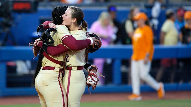Florida State catcher Michaela Edenfield, left, and pitcher Kathryn Sandercock celebrate after...