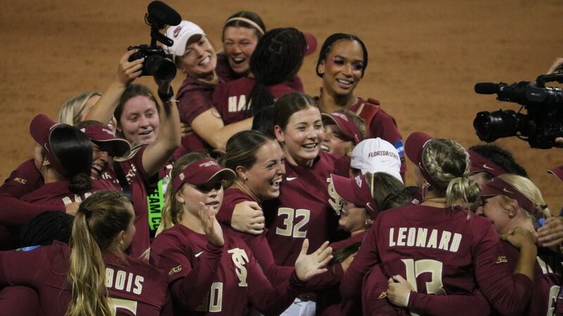 The Florida State Seminoles celebrate sweeping the Georgia Bulldogs en route to the softball...
