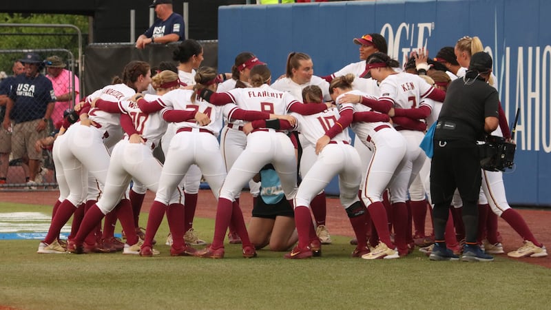 The FSU Softball team huddles up before the Seminoles take on OU in Oklahoma City