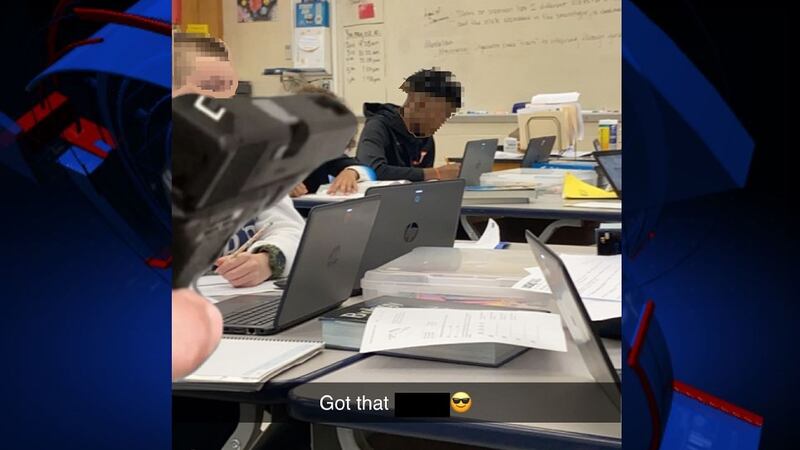 The picture, obtained by WCTV, shows the gun in the foreground, pointed at a black student...
